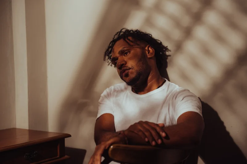 Man sitting quietly, deep in reflective thought